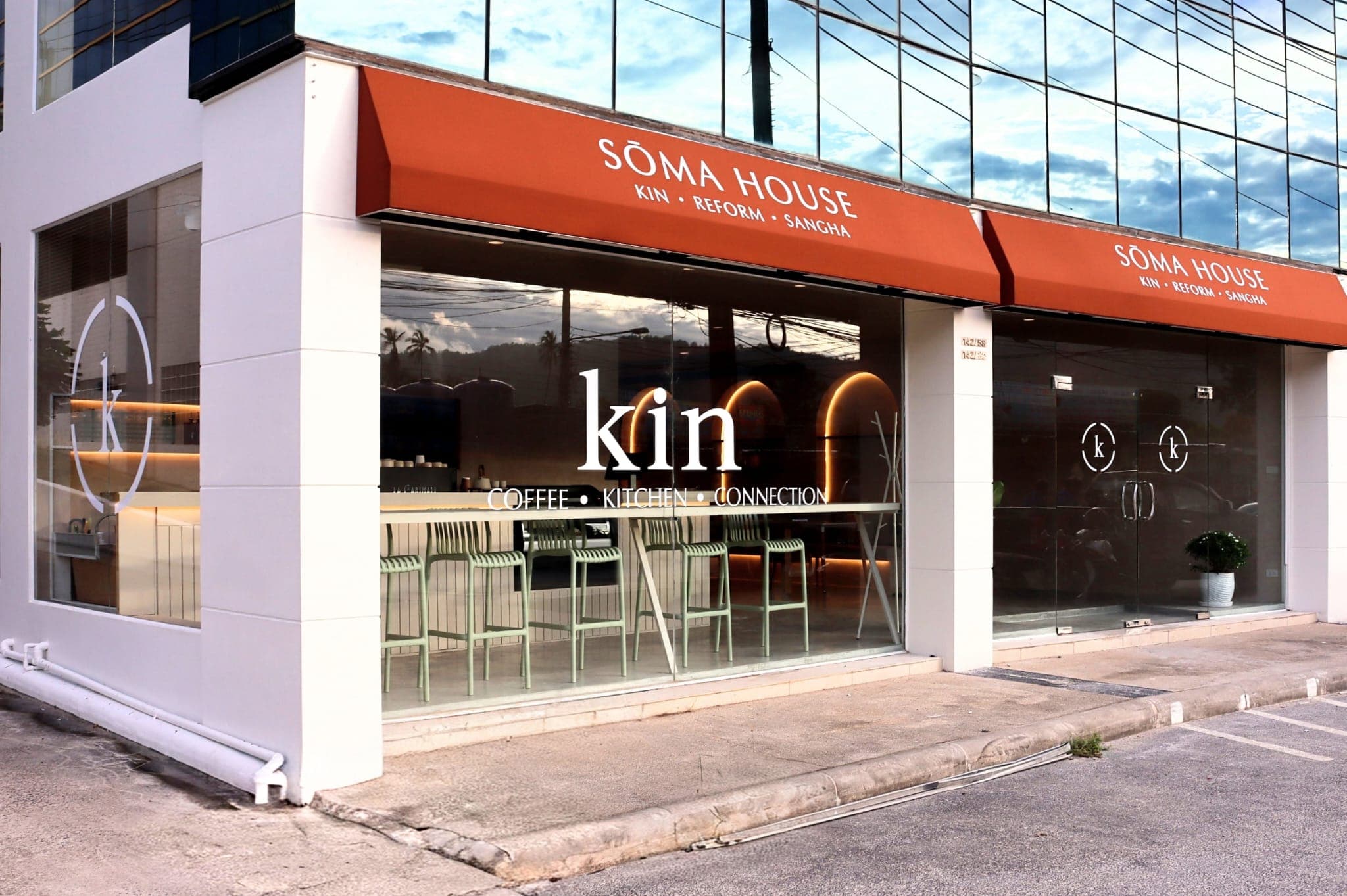 Kin's window under the SŌMA House awning: coffee · kitchen · connection